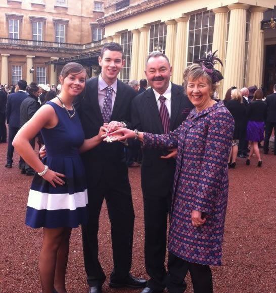 Ian with his family outside Buckingham Palace
